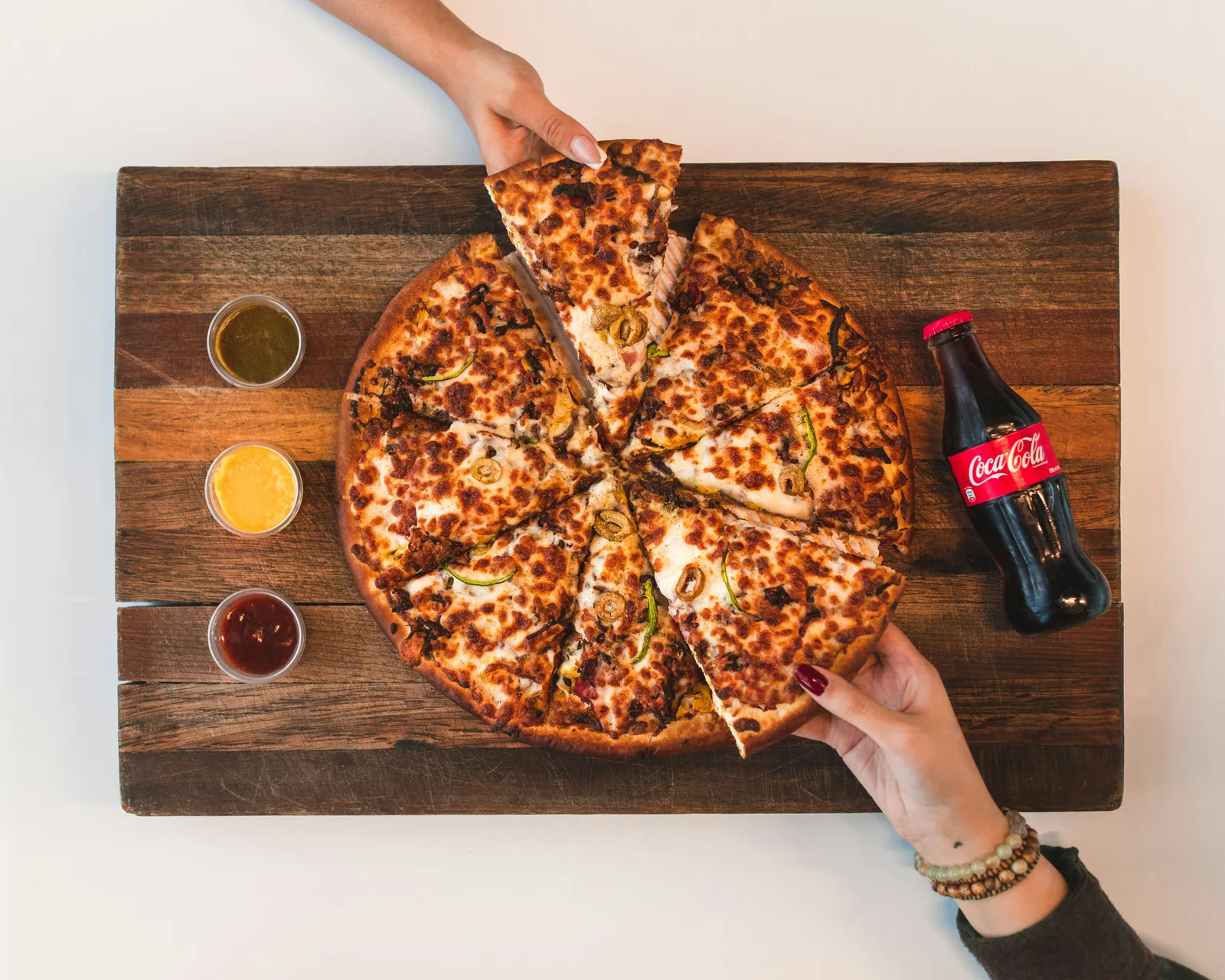 A freshly stone-baked pizza from Hudson's Cafe Pizza served hot and ready in New York, NY